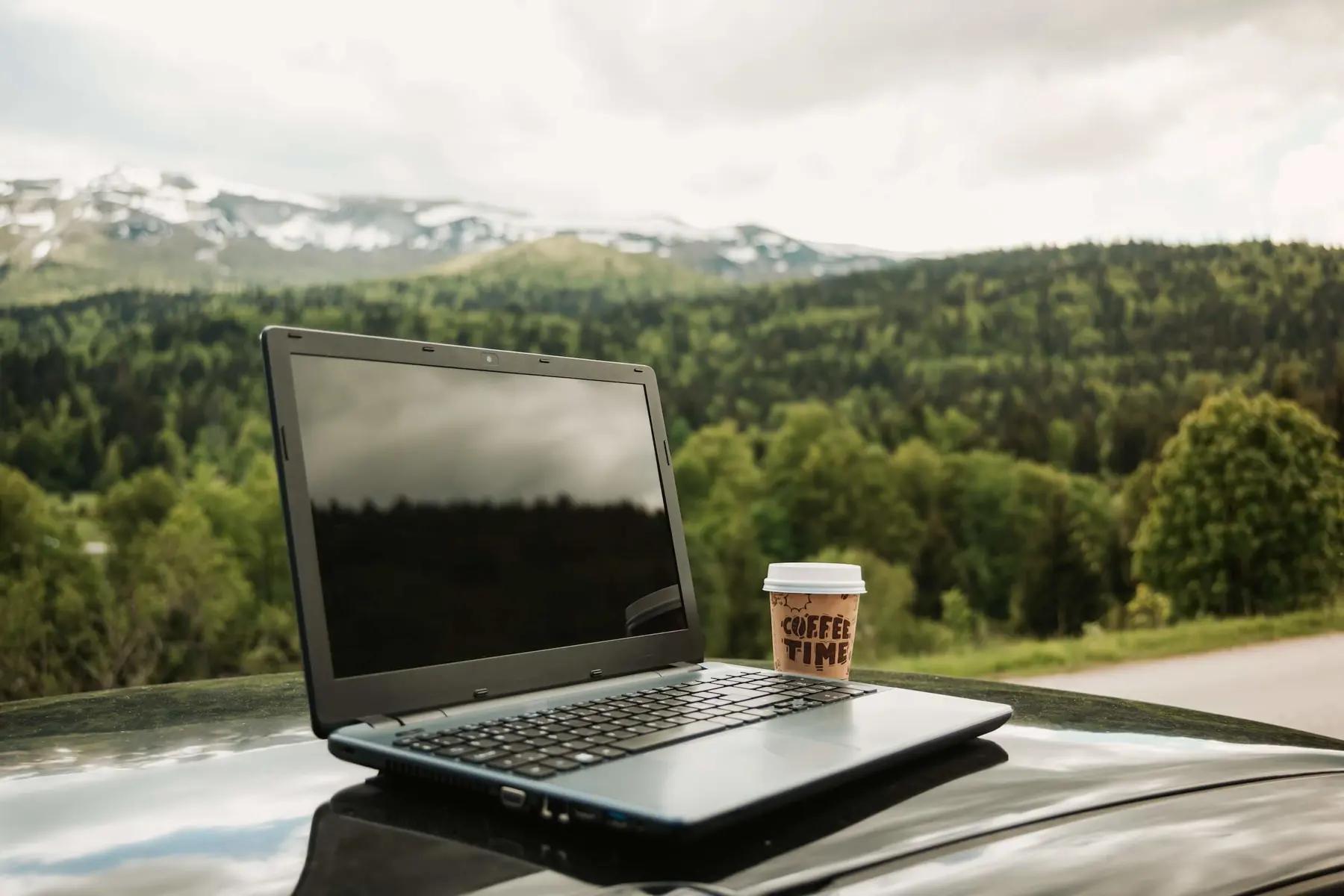 home swapping for digital nomads laptop and mountains